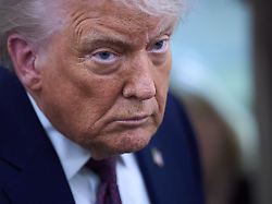 president donald trump speaks with reporters aboard air force one after leaving the world economic forum in davos for washington thursday jan 22 2026
