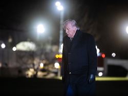 president donald trump walks on the south lawn of the white house after disembarking from marine one jan 22 2026 1