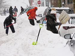 residents dig out their cars in the south boston neighborhood following a winter storm that dump more than a foot of snow across the region monday jan 26 2026 in boston