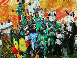 senegal s sadio mane holds the trophy aloft as he celebrates with teammates after winning the africa cup of nations final soccer match between senegal and morocco in rabat morocco sunday jan 18 2026