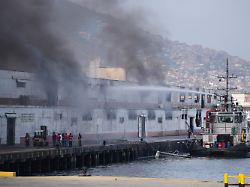 smoke rises from a dock after explosions were heard at la guaira port venezuela saturday jan 3 2026