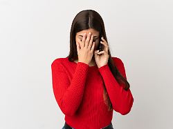 teenager brazilian girl using mobile phone over isolated white background with tired and sick expression