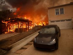 the palisades fire burns a structure in the pacific palisades neighborhood of los angeles wednesday jan 8 2025