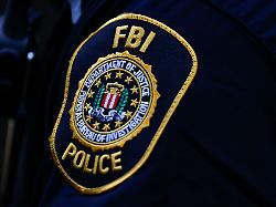 the seal and motto of the federal bureau of investigation on a patch worn by an uniform officer friday sept 22 2023 in washington aaron m