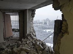 the snow covered capital is seen through the impact hole of a russian drone that hit the top floor of an apartment building amid russia s attack on ukraine in kyiv ukraine january 15 2026