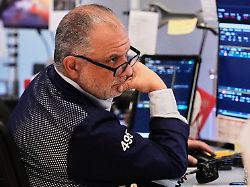 trader joel lucchese works on the floor of the new york stock exchange wednesday jan 7 2026