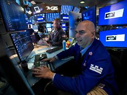 traders work on the floor at the new york stock exchange nyse in new york city u s january 13 2026