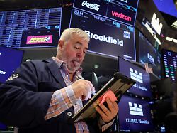 traders work on the floor at the new york stock exchange nyse in new york city u s january 6 2026 1