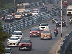 vehicles move on the street in kolkata india on november 23 2025