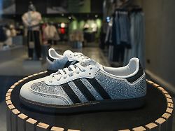 warsaw poland a january 17 a pair of womenas adidas samba og rhinestone crystal white silver sneakers is seen in a shop window in warsaw poland on january 17 2026