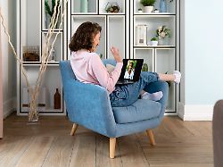 young woman waving on video call through laptop at home model released symbolfoto property released vpif05857