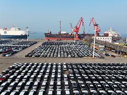 a roll on roll off vessel is parked at the berth to load export vehicles at lianyungang port in jiangsu province china on february 11 2026