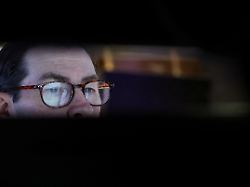 a trader works on the floor at the new york stock exchange nyse in new york city u s february 25 2026