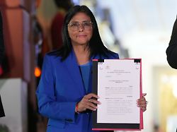 acting president delcy rodriguez displays an amnesty bill approved by the national assembly at miraflores palace in caracas venezuela thursday feb 19 2026