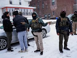 an immigration and customs enforcement ice agent gestures during an immigration raid days after an ice agent fatally shot renee nicole good in minneapolis minnesota u s january 18 2026