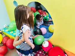 caring teacher guiding a shy pre school girl during playtime model released symbolfoto publicationxinxgerxsuixautxonly copyright xkzenonx panthermedia25861748
