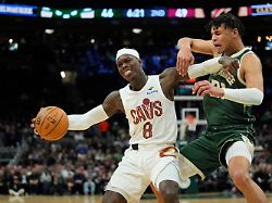 cleveland cavaliers dennis schroeder 8 drives to the basket against milwaukee bucks ousmane dieng during the first half of an nba basketball game wednesday feb 25 2026 in milwaukee
