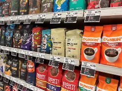 coffee packages with their price tags are on display on a shelf at a supermarket in union city new jersey u s october 15 2025