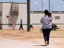 file immigrants seeking asylum walk through the ice south texas family residential center in dilley texas on aug 23 2019