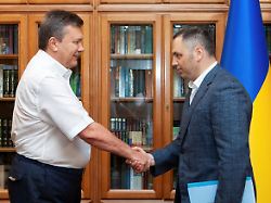 file photo ukrainian president viktor yanukovych and deputy head of his administration andriy portnov shake hands in kyiv ukraine august 2 2010