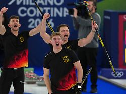 germany s johannes scheuerl marc muskatewitz and benjamin kapp react after the men s curling round robin session against italy at the 2026 winter olympics in cortina d ampezzo italy friday feb 13 2026
