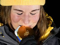 germany s julia taubitz kisses the gold medal after the women s single luge competition at the 2026 winter olympics in cortina d ampezzo italy tuesday feb 10 2026 2