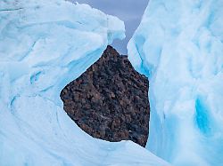 hole in an iceberg belcher island devon island nunavut canadian arctic canada north america