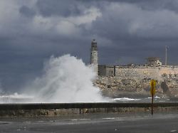 huge waves break over havana s light tower in havana cuba february 1 2026