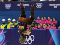 ilia malinin of the united states does a back flip while competing during the men s figure skating short program at the 2026 winter olympics in milan italy tuesday feb 10 2026