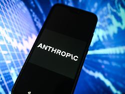 in this photo illustration a anthropic logo is displayed on a smartphone with stock market percentages in the background