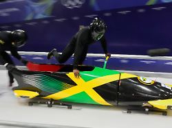 jamaica s shane pitter right starts for a two man bobsled training session at the 2026 winter olympics in cortina d ampezzo italy saturday feb 14 2026