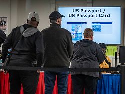october 16 2024 toledo ohio voters prepare to hand election workers their voter ids during the voter registration check in valid ids include u s passports and passport cards