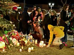 people react during a vigil the day after a deadly mass shooting took place in the town of tumbler ridge british columbia canada february 11 2026