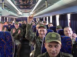 russia moscow region may 25 2025 russian servicemen released from ukrainian captivity are seen on a bus 303 russian servicemen return home video grab best quality available