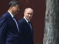russian president vladimir putin right speaks with chinese president xi jinping during a walk at the zhongnanhai leadership compound in beijing china tuesday sept 2 2025