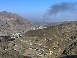 smoke emits from afghan side as trucks are parked along roadside following cross border clashes between pakistan and afghan forces at near torkham border crossing point pakistan saturday feb 28 2026