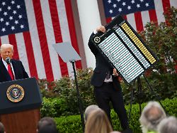 u s secretary of commerce howard lutnick holds a chart as u s president donald trump delivers remarks on tariffs in the rose garden at the white house in washington d c u s april 2 2025