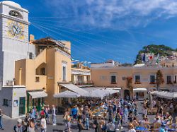 view of clock tower and cafes in piazza umberto i la piazzetta capri town isle of capri bay of naples campania italy mediterranean europe