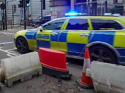 a metropolitan police estate vehicle responds with its flashing blue emergency lights in london england united kingdom on december 22 2025