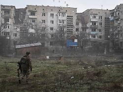 a ukrainian service member walks near residential buildings damaged by russian military strikes amid russia s attack on ukraine in the frontline town orikhiv in zaporizhzhia region ukraine march 26 2026