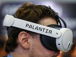 a man tries the palantir maven smart system during the defence security equipment international dsei japan at makuhari messe in chiba east of tokyo japan may 21 2025