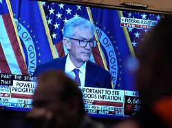 a television carries a news conference by federal reserve chair jerome powell on the floor of the new york stock exchange in new york wednesday march 18 2026