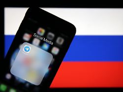 ankara turkey january 12 logo of telegram is seen in front of flag of russia in ankara turkey on january 12 2020