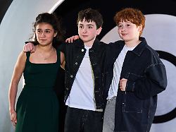 arabella stanton dominic mclaughlin and alastair stout pose for photographers upon arrival at the hbo max launch party in london england wednesday march 25 2026