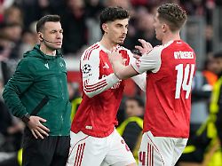 arsenal s kai havertz center enters the pitch during the champions league round of 16 first leg soccer match between bayer leverkusen and arsenal fc in leverkusen germany wednesday march 11 2026