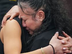 carmen mejia hugs one of her daughters for the first time in 20 years after her exoneration hearing in travis county s 460th criminal district court in austin texas monday march 9 2026