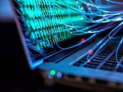 computer virus and cyber attack visualized on laptop with binary code property released abrf01416