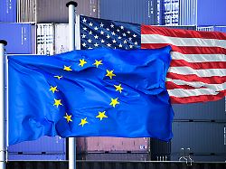 eu and us flag in front of stacked containers customs dispute and customs agreement between eu and usa photomontage