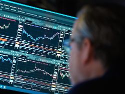 financial information is displayed on the floor at the new york stock exchange in new york wednesday march 4 2026