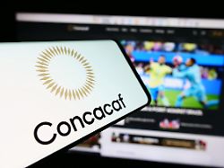 in this photo illustration a mobile phone with the logo of football association concacaf is seen in front of website